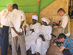 David Pressman '04 (lower right) and George Clooney (right)